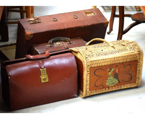 A distressed canvas suitcase, a 1970s wicker hamper (af), a brown leather briefcase with stitched detail and a ladies' handba