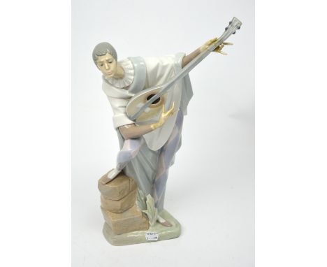 A large Lladró figure of a harlequin playing a lute, height 47cm (af).   CONDITION REPORT  Breaks to fingers on both hands, b