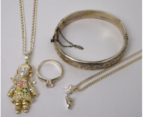 A hallmarked silver bangle, a silver dress ring set with a white stone, a white metal chain with a shoe pendant and a silver 