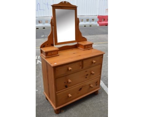 A modern pine washstand with detachable back shelf and swivel mirror, length 98cm.