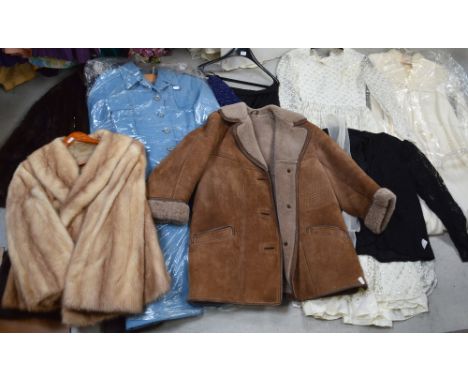 A large selection of 20th century vintage clothing to include a c1980s wedding dress, mink jacket, a fur coat etc.