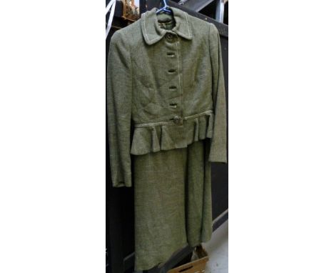 A 1970s Christian Dior green wool suit, with A-line dress and peplum waist to the jacket.   CONDITION REPORT  No major damage