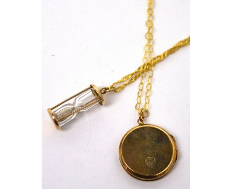 A 9ct gold chain with a yellow metal octagonal locket and a 9ct gold chain with an egg timer glass pendant.