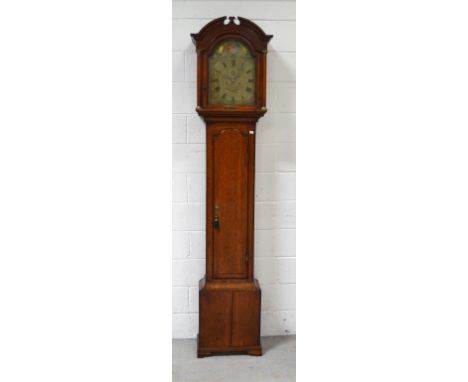 An early 19th century oak eight-day longcase clock, arched brass dial with date and moon phase, subsidiary seconds and apertu