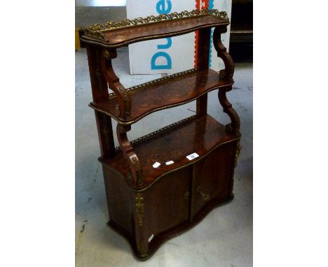 A small inlaid ormolu-mounted wall-hanging cabinet, three serpentine-shaped shelves leading to small cupboards with single sh