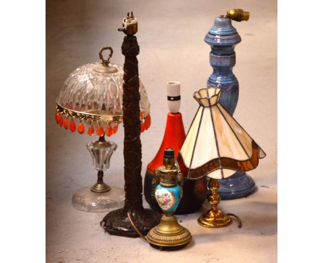 A Tiffany-style table lamp, a 1970s Ingmans Swedish orange lamp base, a crackle glazed blue and purple table lamp base, a mou