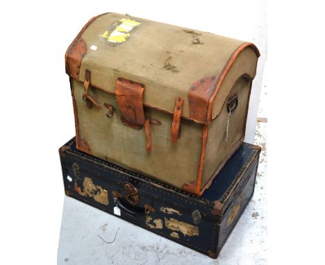 An Edwardian black metal travelling trunk with various labels to include London and North Eastern Railway labels, length 77cm