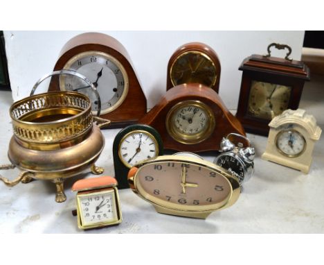 A mixed quantity of clocks to include a leather John Moor & Son, Clerkenwell bedside clock, a mahogany transfer-decorated man