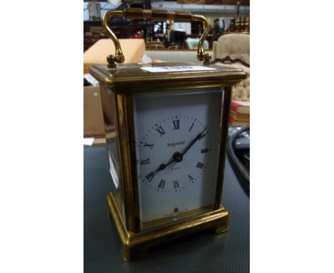Bayard; an eight-day carriage clock, lacquered brass case with an enamelled dial set with Roman numerals.