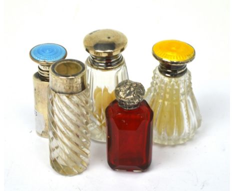 A George V hallmarked silver scent bottle with blue enamel inset top, Henry Perkins & Sons, London 1923, three further assort