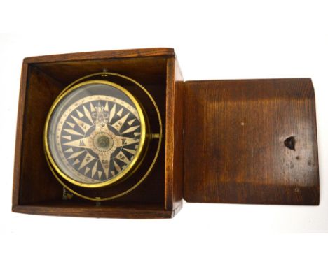 An oak-cased Berry & Mackay of Aberdeen brass ship's compass, diameter 14cm.