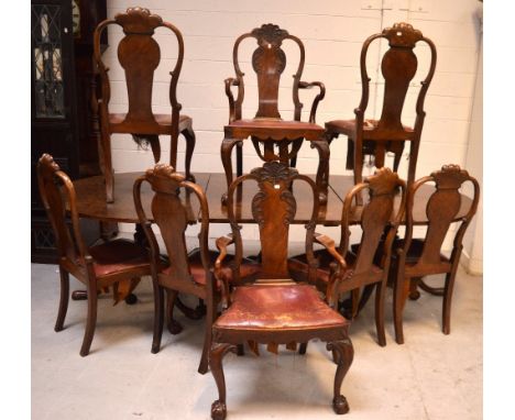 A large Edwardian walnut dining table on three baluster supports, two D-ends converting to separate side tables and two panel