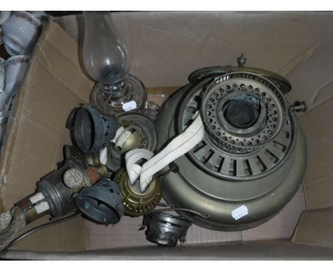 A VICTORIAN BRASS HEATER and various spare parts and a glass paraffin lamp (1 box)