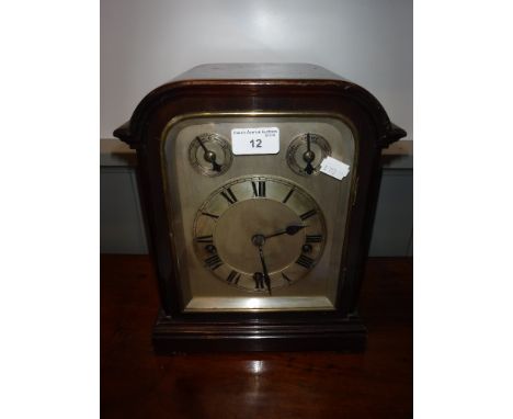 A LATE 19TH/EARLY 20TH CENTURY CHIMING MANTEL CLOCK, the movement impressed 'W & H. Son' with a brushed steel dial, 11.25" hi
