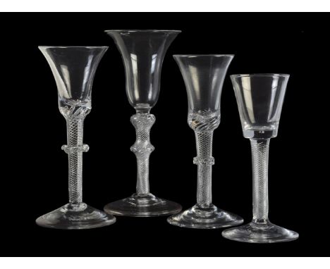 Four assorted airtwist wine glasses, third quarter 18th century, including two with vermicular knops, 18.5cm high and smaller