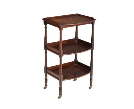 A George IV rosewood three tier whatnot,  circa 1825, with ring turned column supports and conforming legs, on brass caps and