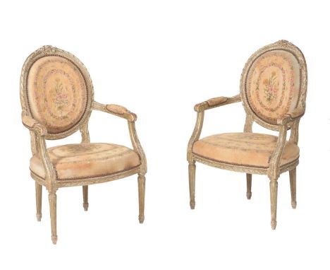 A pair of French green painted and tapestry upholstered armchairs in Louis XV style, 20th century