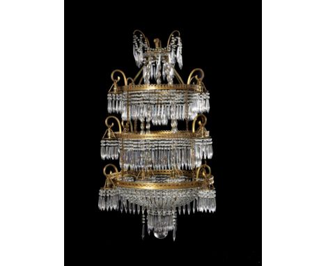 A gilt metal and cut glass hung seventeen light electrolier, mid 20th century, with three tiers of concentric circlets each w