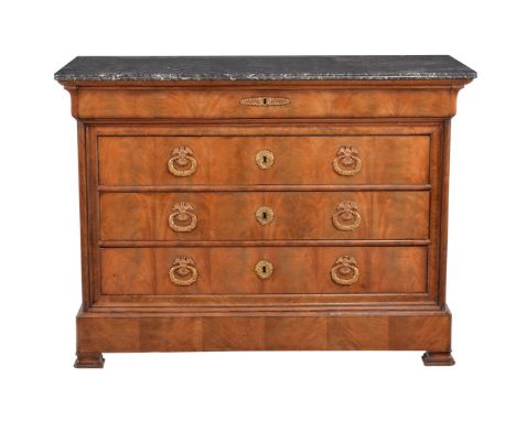 A Louis Philippe walnut commode, circa 1840, with grey fossilised marble top above a blind frieze drawer, three long drawers,