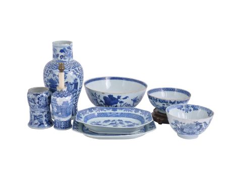 A Chinese blue and white deep bowl, Qianlong, the exterior painted with a bird perched on a flowering peony tree, 23cm diamet