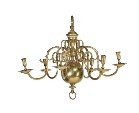 A Dutch or English cast and turned brass six light chandelier, first half 18th century, the scrolled arms issuing from a knop