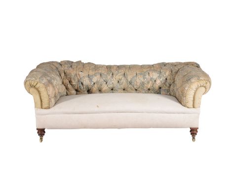 A Victorian walnut and upholstered sofa, circa 1890, century, of Chesterfield type, in need of reupholstery but with remnants