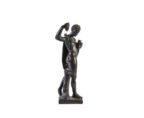 A Continental, probably Italian, carved and ebonised wood model of a youthful Bacchus, 18th century, portrayed standing contr