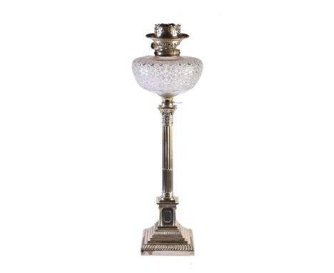 An Edwardian silver columnar table oil lamp, circa 1905 and later converted to electricity, with cut glass reservoir,  hallma