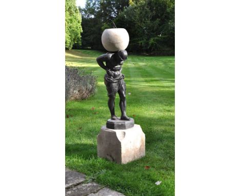 A cast lead and limestone mounted figural sundial, the dial dated 1725, the remainder later, the octagonal dial mounted on a 