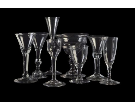 Seven assorted plain stemmed and baluster wine glasses, various dates mid-18th century, including a slender stemmed toasting 