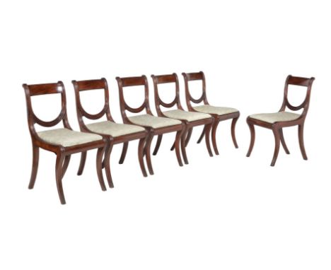 A set of six Regency mahogany dining chairs, circa 1820, in the manner of William Wilkinson, each with bar back above a U-sha