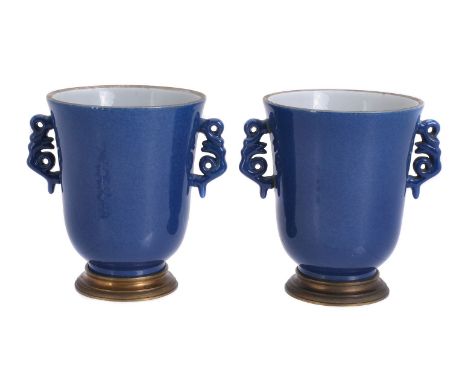 A pair of Samson powder-blue ground and gilt-metal mounted two-handled pot pourri urns in Kangxi style, late 19th century, bl