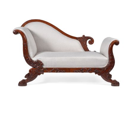 A Continental carved mahogany and upholstered day bed, in Empire taste, first half 19th century, the padded back, arms and se