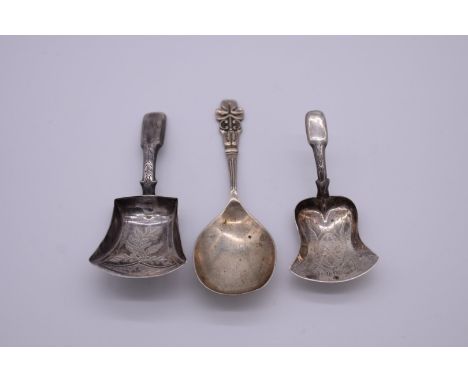 A George IV silver caddy spoon, by Joseph Taylor, Birmingham 1825; together with two others. 
