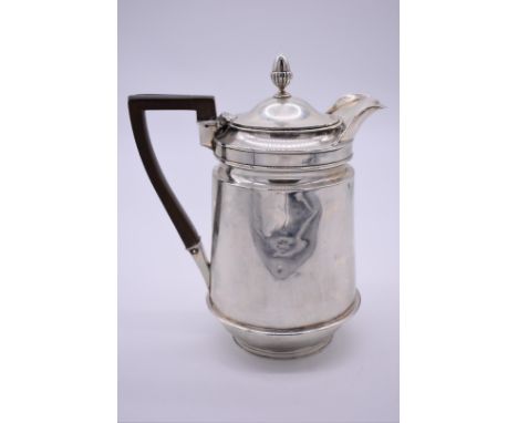A George III silver hot water jug, by John Eames, London 1805, having acorn finial, 22cm high, 651.5g all in. 