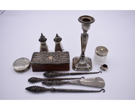 A quantity of silver and silver mounted items, including: a .925 pig pin cushion; a candlestick; and a pair of peppers etc, 1