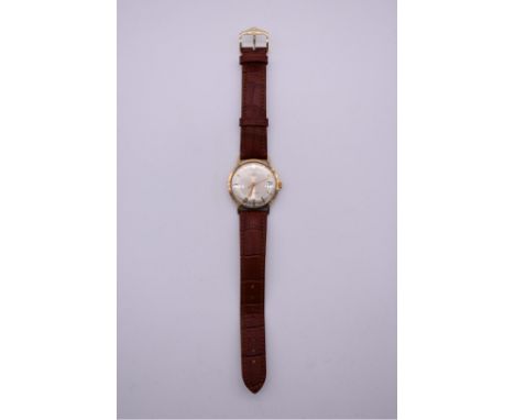 A vintage 9k gold Benson manual wind wristwatch, on replacement Hirsch leather strap. 
