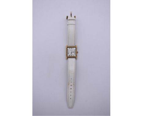 A vintage Roy King silver gilt wristwatch,&nbsp;hallmarked London 1975, on replacement white leather strap. 
