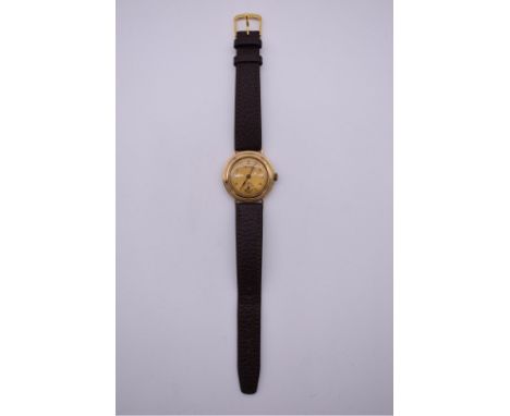 A vintage Accurist 9ct gold manual wind wristwatch, 30mm, hallmarked Birmingham 1943, on replacement leather strap. 
