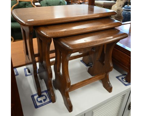 A nest of three teak occasional tables by Ercol, 57 x 36 x 42 cm high 