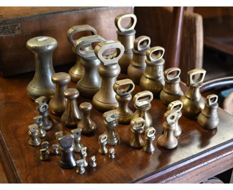 A quantity of antique and vintage brass and bell-metal weights, bank-weights, etc 