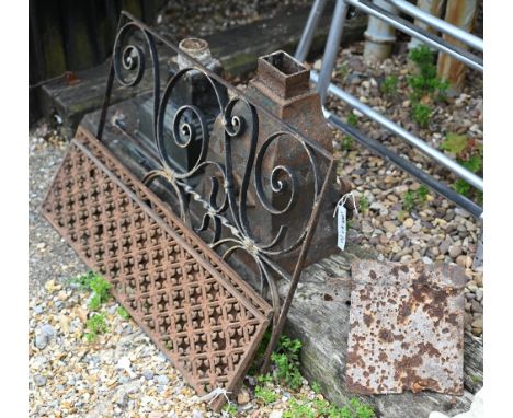 Two differing cast iron rainwater hoppers to/w a pair of cast iron grilles, a wrought iron panel and a cast iron ridge tile (