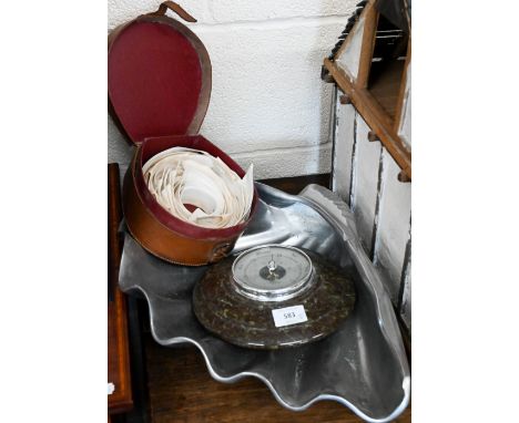 An aluminium clam-shell bowl, 53 cm wide, to/w an aneroid barometer in turned serpentine case and a vintage leather collar-bo