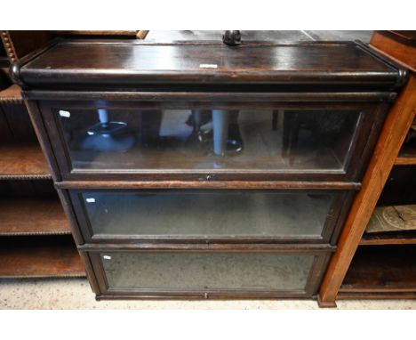 An early 20th century oak three tier Globe Wernicke barrister's bookcase, 86 x 26 x 90 cm h 