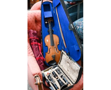 A cased Buffet clarinet, to/w a violin and bow and two folding music stands (4) 