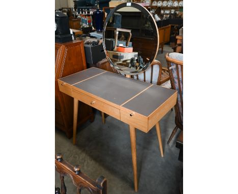 A modern light oak dressing table with bevelled circular mirror on splayed turned supports, 100 cm wide x 46 cm deep x 142 cm