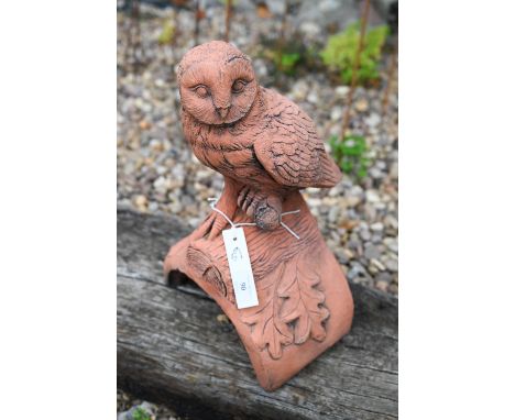 A cast terracotta owl ridge tile 
