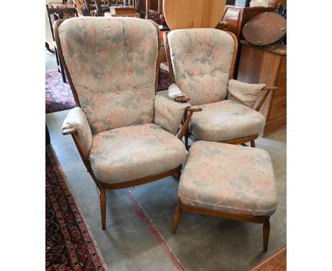 Two Ercol dark elm (Golden Dawn) easy armchairs (models 914 and 915) to/w Ercol extension stool (model 205) dated 1993, Gold 