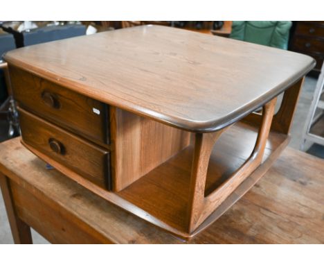 A mid-century Ercol Golden Dawn elm Pandora coffee table on ball casters, 80 x 80 x 40 cm high 