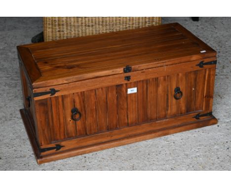 A stained hardwood metal mounted trunk, 75 cm wide x 36 cm deep x 35 cm high 